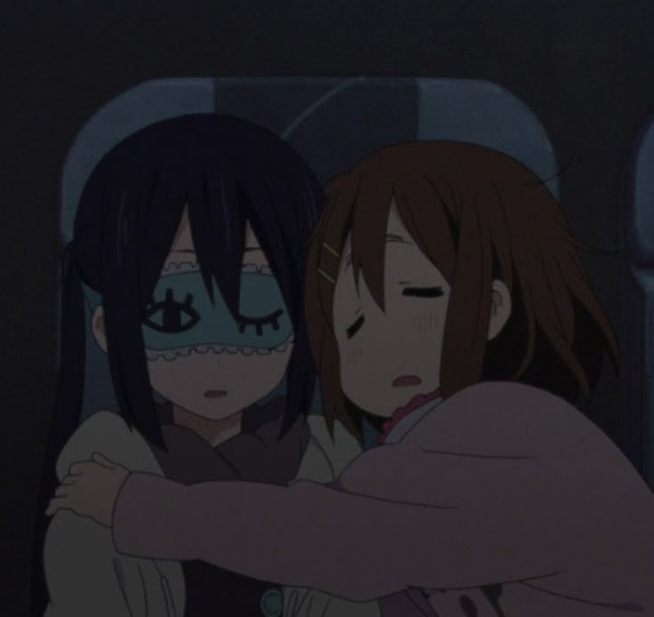 two anime characters hugging each other in the dark room with their eyes closed and one has her arm around the other's shoulder