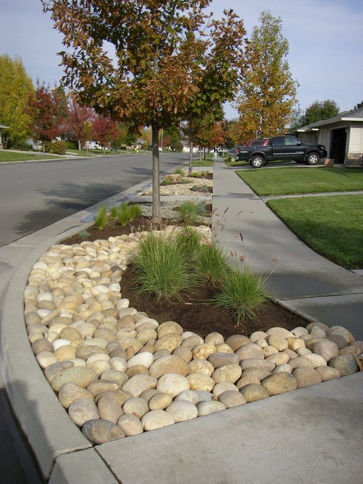 there is a rock garden in the front yard