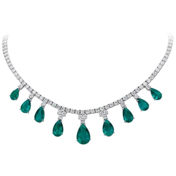 An Elegant Necklace Set with 9 Emeralds weighing 20.43 Carats and 17.74 Carats of Diamonds. Set in 18 Karat White Gold. Measures 16 inches. Complete Suite available, please inquire. 1stdibs Jewelry, Emerald And Diamond Necklace, Radiant Cut Diamond Ring, Diamond Drop Pendant, Pear Shaped Diamond Ring, Emerald Necklace Pendant, Jewelry Emerald, Antique Necklaces, Sapphire And Diamond Earrings