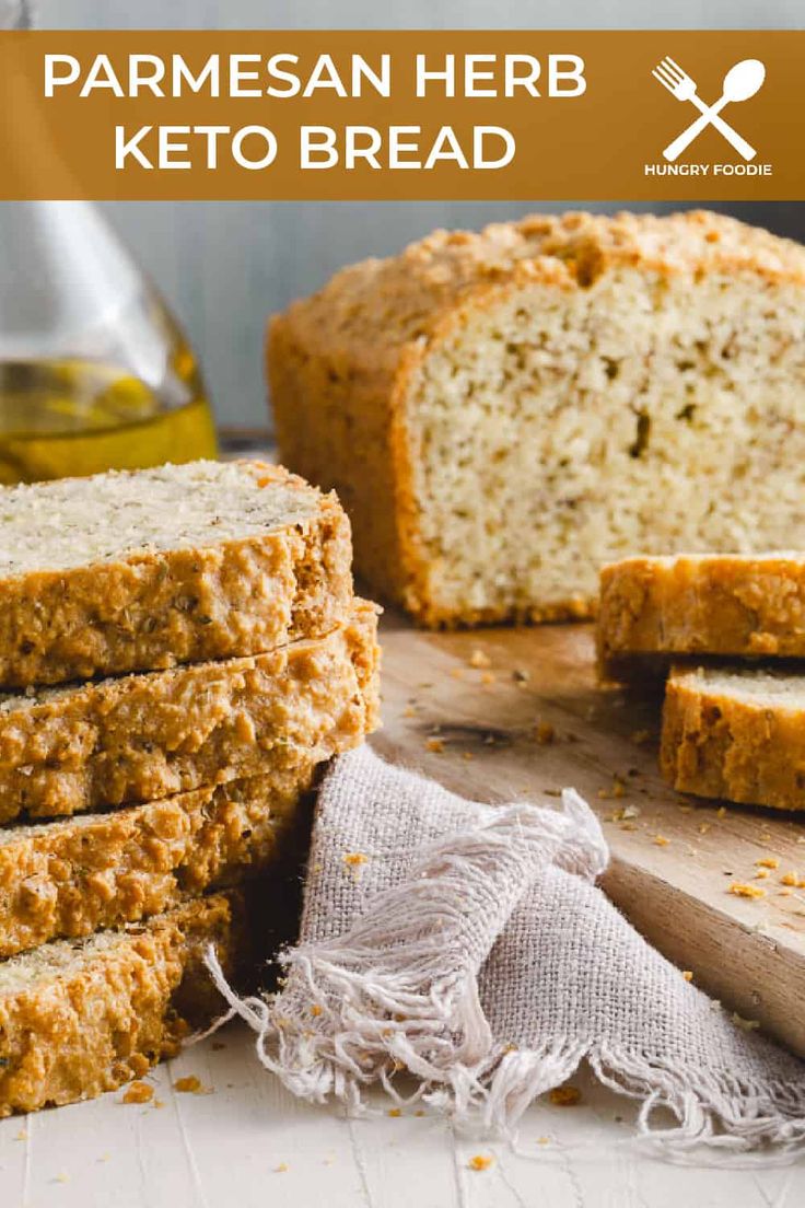 a loaf of parmesan herb keto bread cut in half and stacked on top of each other