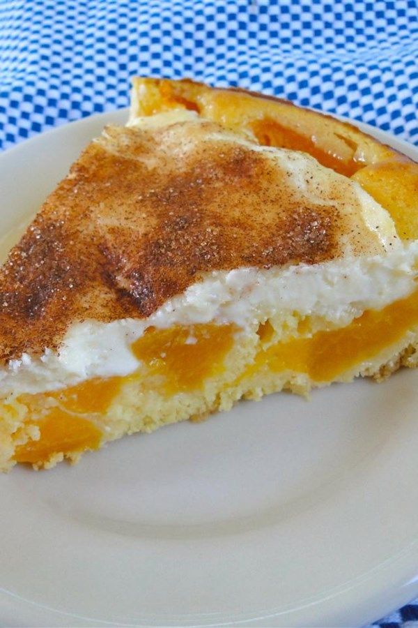 a piece of pie on a plate with blue and white checkered table cloth behind it