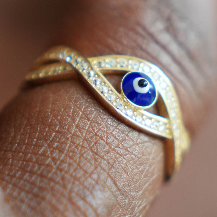 Our widely popular and one of a kind evil eye infinity Ring is our most sold piece. It symbolizes eternal and lasting love as the eye never ends. It is believed that the evil eye provides magical protection from evil and this fantastic key to happiness is a big plus for any admirer in you life. A must for every jewelry collection! ✨Product Specifics✨ All specifications are approximate and may vary for the same model. Weight (gm): 2.6 Metal: Yellow Gold Metal Purity: 14K Finish: High Polished, En Symbolic Evil Eye Jewelry Ring, Symbolic Evil Eye Ring Jewelry, Spiritual Evil Eye Ring Jewelry, Fine Jewelry Rings With Evil Eye For Gifts, Fine Jewelry Evil Eye Ring As Gift, Fine Jewelry Evil Eye Rings For Gifts, Elegant Evil Eye Rings As Gift, Spiritual Evil Eye Rings As Gift, Protection From Evil