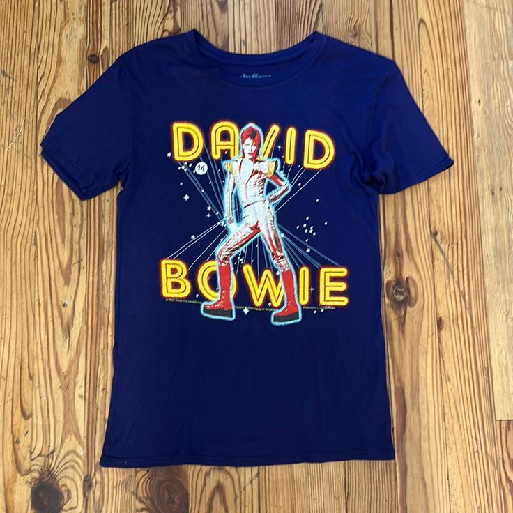 Nwt! David Bowie Tee! Blue Band Merch T-shirt With Logo Print, Fitted Blue T-shirt With Character Print, Blue Cotton Pop Culture T-shirt, Blue Unisex Shirt With Letter Print, Blue Cotton Pop Culture Tops, Blue Fan Apparel Tops With Character Print, Blue T-shirt With Character Print In Relaxed Fit, Blue Graphic Print Shirt For Fans, Blue Tops With Character Print For Fans