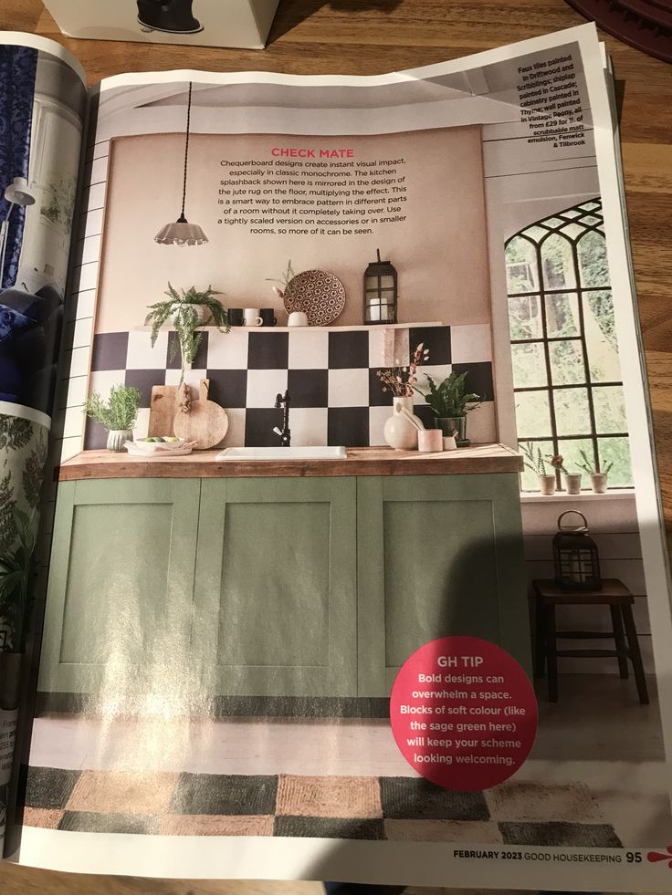 an open magazine with pictures of kitchen furniture