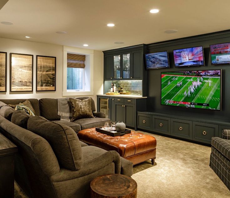 a living room filled with furniture and a flat screen tv mounted to the side of a wall