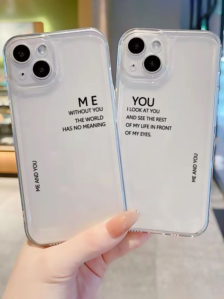 two clear cell phones with the words me and you written on them in cursive font