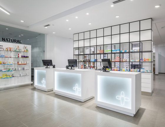 the inside of a store with white counter tops