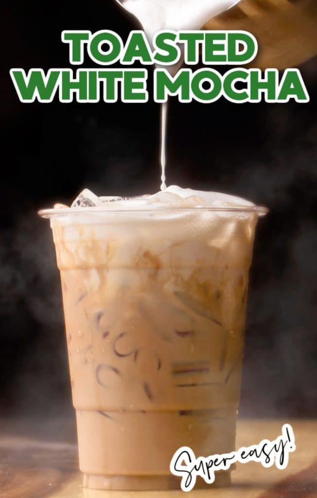 a drink being poured into a cup with the words toasted white mocha on it