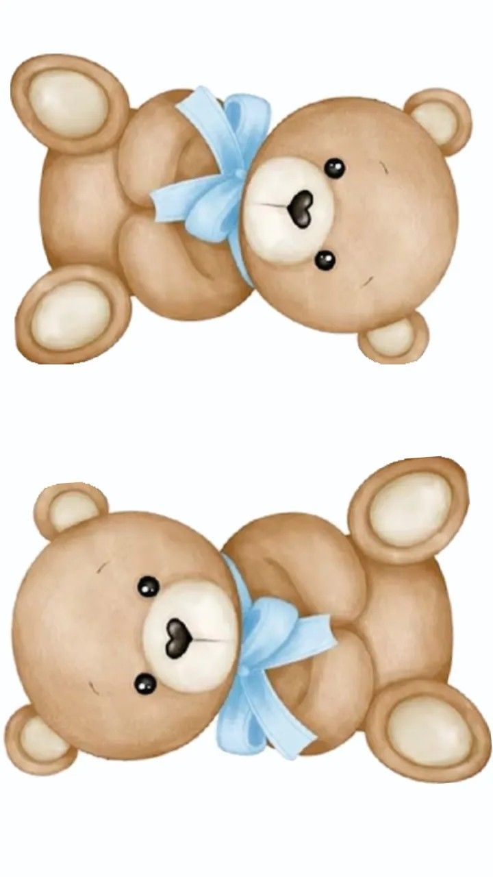 two brown teddy bears sitting next to each other on top of a white surface with blue bows