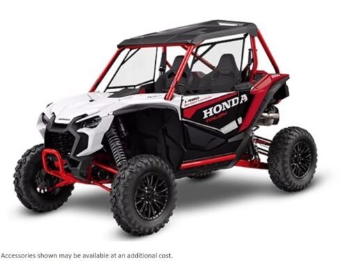 a white and red honda utv on a white background