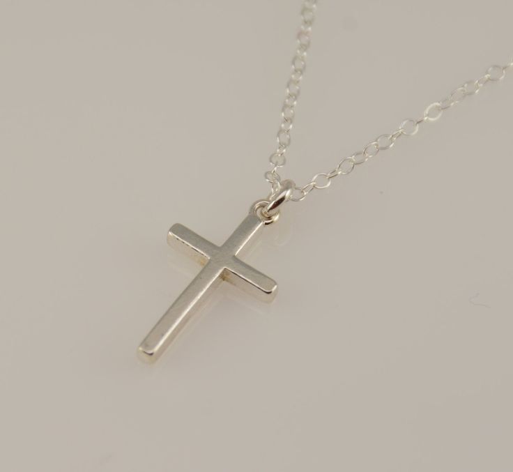 "Cross necklace. Sterling silver cross necklace. Christening gift. Baptism gift, Baptism necklace ♡ Sterling silver cross charm is 3/4\" x 7/16\". ♡ Sterling silver necklace Size chart - girl's necklace average 0 - 24 months 10\"-12\" average 2 - 3 years 13\" average 4 - 5 years 14\" average 5 - 10 years 15\"-16\" average 10 - 16 years 16\"-18\" All of the findings are sterling silver. The necklace will arrive in a nice gift box, ready for delivery. To see more children jewelry click on the link Minimalist Cross Pendant Necklaces For Baptism, Minimalist Cross Pendant Necklace For Baptism, Silver Crucifix Necklace For Baptism, Silver Cross Necklace For Baptism, White Cross Pendant Necklace For Baptism, White Cross Necklace For Baptism, Sterling Silver Cross Pendant Necklace For First Communion, Sterling Silver Cross Necklace For First Communion, Silver Cross Necklace For Confirmation