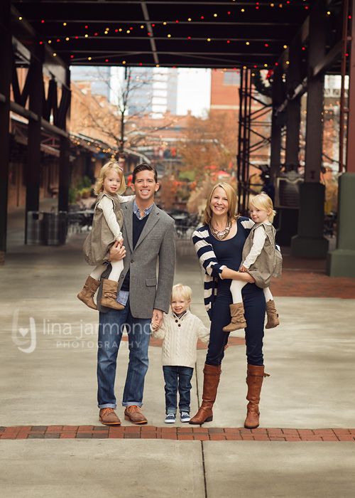 a man, woman and two children posing for a photo