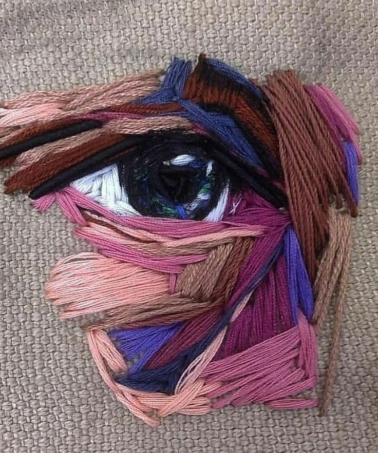 an eye made out of yarn on the floor