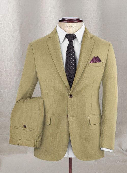 When it comes to high-quality clothes and luxury craftsmanship, Napolean is hard to beat. Our Napolean Sahara Khaki Wool Suit is crafted from wool blend with the natural elegance of wool with durability, versatility and stress-free comfort. Cut to a tailored fit in a fabric that's almost plain until you get up close – a fine structure gives it plenty of texture and couldn't be easier to style. 
 
 Look Includes  Napolean Sahara Khaki Wool Fabric  Two Button Jacket Style  Notch Lapel  Horn Brown Brown Wool Three-piece Single Breasted Suit, Brown Wool Single-breasted Suits, Beige Single-breasted Suit With Notch Lapel, Khaki Single-breasted Blazer With Notch Lapel, Double-breasted Khaki Wool Outerwear, Grey Tweed Suit, Green Velvet Jacket, Herringbone Tweed Jacket, White Linen Suit