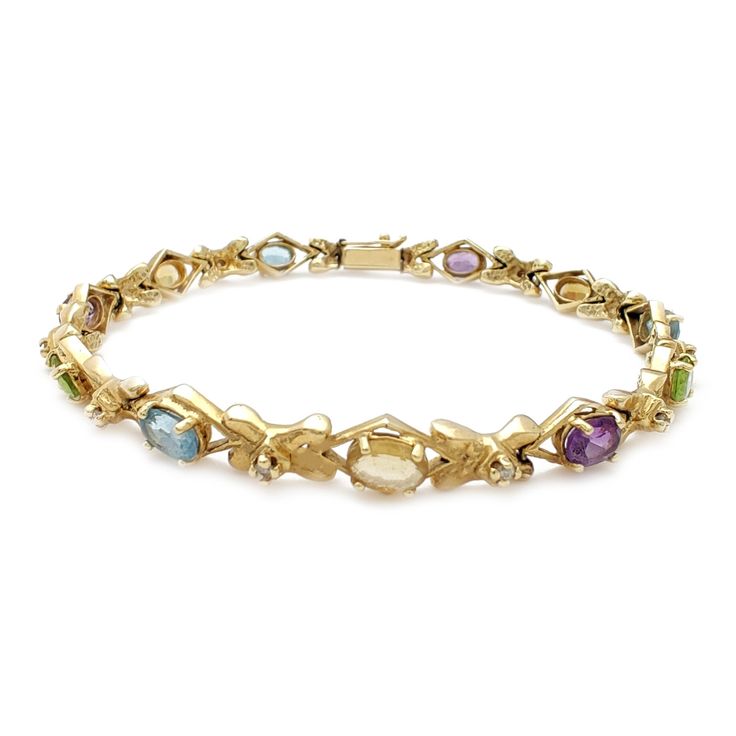 Precious Metal: 14 Karat Yellow Gold Type of Clasp: Custom Box Lock Gemstone: Diamonds (Round) [0.10 Carats] Aquamarine (Oval) Yellow Topaz (Oval) Amethyst (Oval) Peridot (Oval) Width: 6.4 mm* Length: 8 Inches* (End to end) Weight: 14.6 grams* *All weights and measurements are approximate. Please contact us if you have further questions about alternate sizes or styles, availability, specifications, and personalization options. Elegant Multicolor Diamond Bracelet For Formal Occasions, Elegant Multicolor Gold Bracelet For Formal Occasions, Elegant Multicolor Gold Bracelet For Formal Events, Yellow Gold Oval Bracelet With Multi-stone, Yellow Gold Multi-stone Oval Bracelets, Yellow Gold Multi-stone Oval Bracelet, Yellow Gold Oval Multi-stone Bracelet, Marquise Yellow Gold Bracelets For Formal Occasions, Elegant Multicolor Multi-stone Gold Bracelet