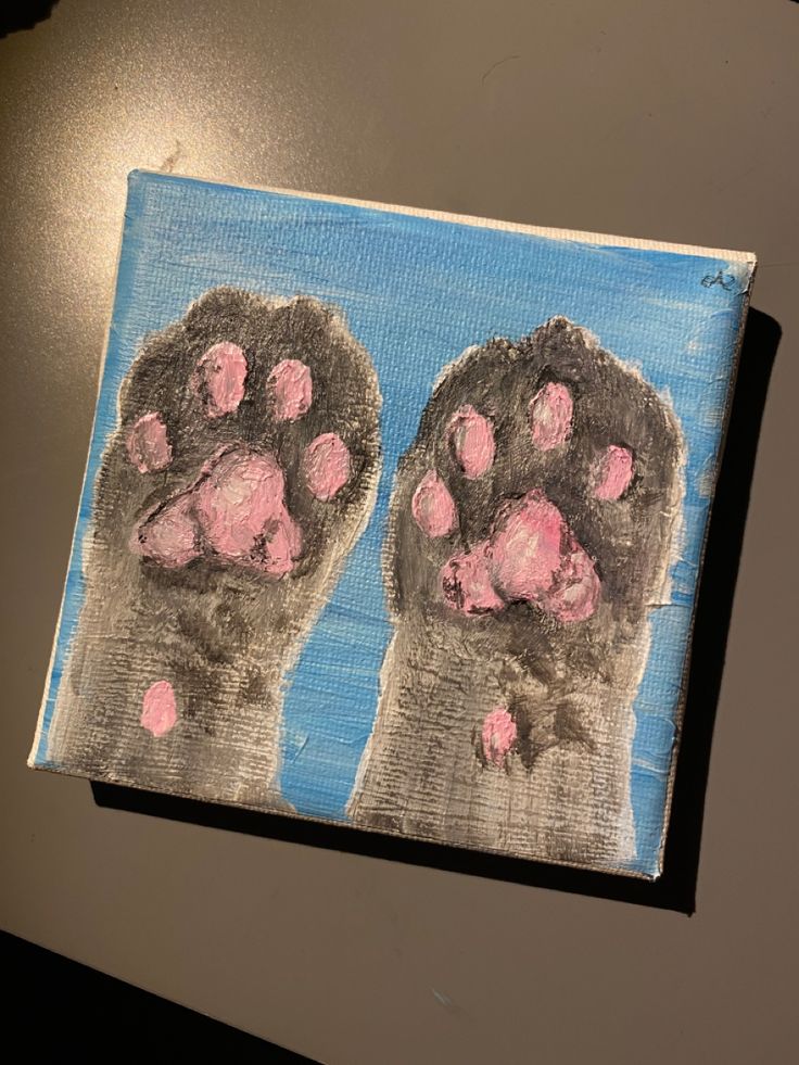 a piece of art that looks like someone's feet with pink paint on them