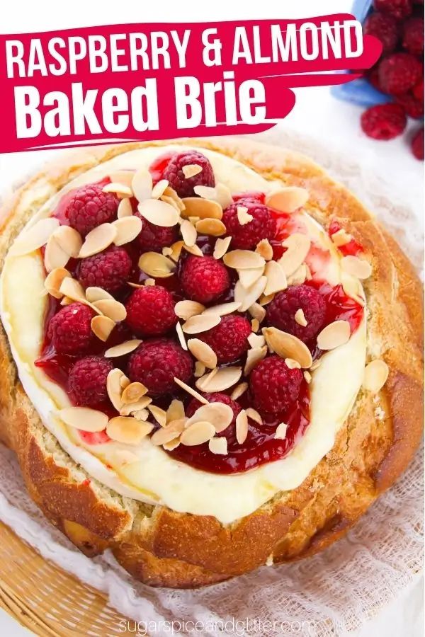 raspberry and almond baked brie on a plate with the title above it