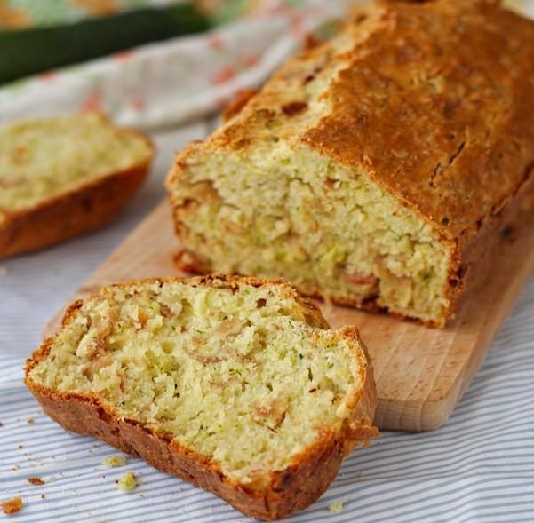 a loaf of bread sitting on top of a wooden cutting board