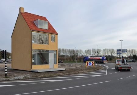 a small house on the side of a road