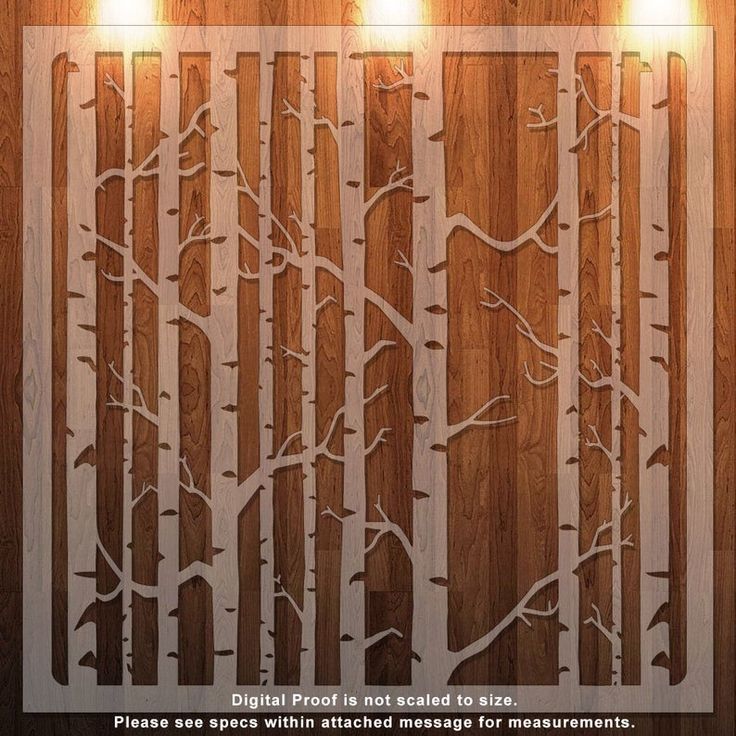 a wooden wall with some lights hanging from it's sides and trees in the middle