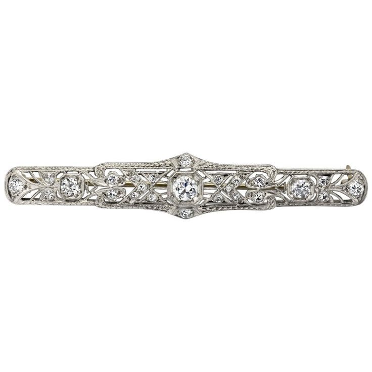 A long panel brooch of open-work design set with old European cut diamonds weighing 0.88 carats total. Hand-engraved with an intricate design. Made in platinum. Diamond Flower Brooch, Gold Star Pendant, Brooch Art, Victorian Pendants, Art Deco Brooch, Diamond Pendant Sets, Beautiful Bracelets, Diamond Brooch, Work Design