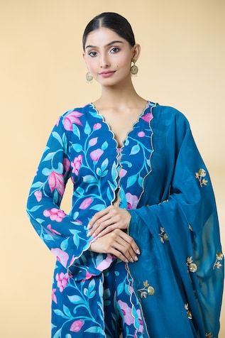 Teal blue scallop trimmed kurta with floral bloom prints. Paired with a matching palazzo and dupatta with scattered aari, zardozi hand embroidered buttis. - Aza Fashions Blue Floral Chanderi Kurta, Unstitched Blue Floral Traditional Wear, Unstitched Blue Floral Print Traditional Wear, Blue Floral Print Unstitched Traditional Wear, Blue Floral Print Sharara For Eid, Blue Floral Print Dupatta For Navratri, Unstitched Blue Floral Print Sharara, Blue Floral Print Unstitched Sharara, Traditional Blue Floral Print Palazzo Set