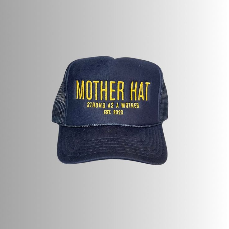 Introducing the Mother Hat, a hat that tells many stories. School drop-off, road trips, soccer games, slow weekends. Let this hat bring you many memories and be a reminder of your incredible strength as a mother. Design is embroidered in gold across our premium navy trucker hat. Features: High profile, structured Color: Navy Design embroidered in gold Slightly curved visor Foam trucker with nylon mesh back "Strong as a mother" tag inside hat Plastic snapback We donate 10% of our proceeds to char Adjustable Dad Hat With Curved Brim For Fans, Curved Brim Dad Hat Fan Merchandise, Sports 5-panel Hat With Letter Print, Adjustable 5-panel Hats For Fan Merchandise, Adjustable 5-panel Hat For Fan Merchandise, Trucker Hat With Letter Print For Sports, Trucker Sports Hat With Letter Print, Adjustable Curved Bill Trucker Hat For Fans, Adjustable Curved Bill Trucker Hat For Fan Merchandise