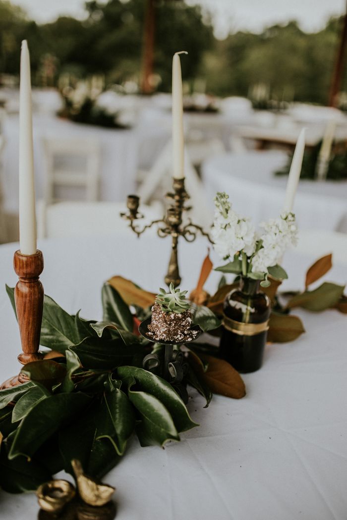 some candles are sitting on top of a table