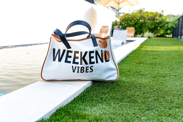 Description: Weekend Vibes Tote Bag It’s your time to snag this weekend vibes getaway tote bag and fill it with your weekend goodies, your pool day essentials, or treat it as your overnight bag. Say no more! *add to cart* Details Accessories Summer staple 20” L x 5” W x 11” H 11.2 OZ Summer Weekend Beach Tote Bag, Trendy Summer Beach Bag For Weekends, Summer Tote Bag For Weekend, Large Capacity Beach Bag For Summer Weekend, Large Capacity Rectangular Travel Bag For Weekend, Summer Weekend Tote Bag, Trendy Bags For Weekend Beach Season, Trendy Beach Weekend Bags, Trendy Beach Season Weekend Bags