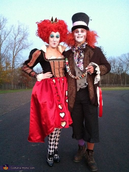 two people dressed in costumes standing next to each other