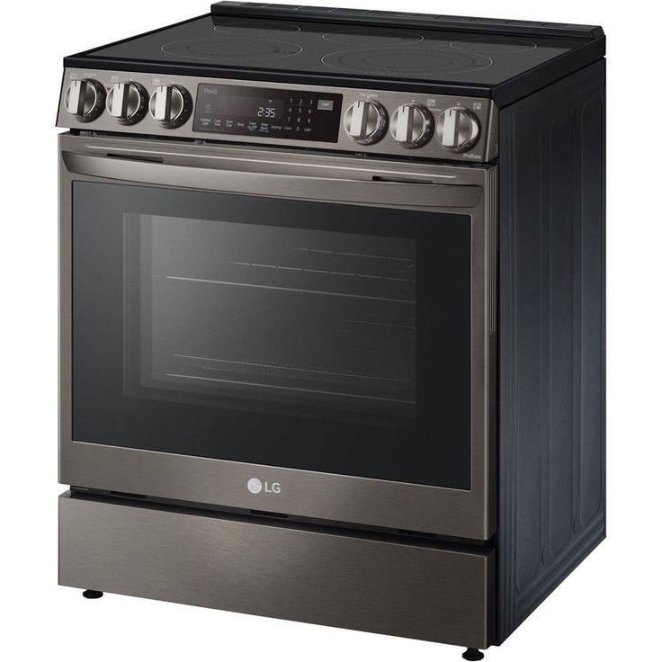 a black and stainless steel oven with four burners on the front, and one door open