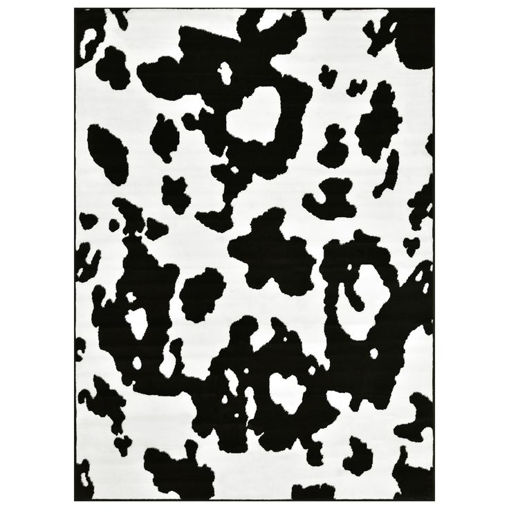 an animal print rug with black and white spots