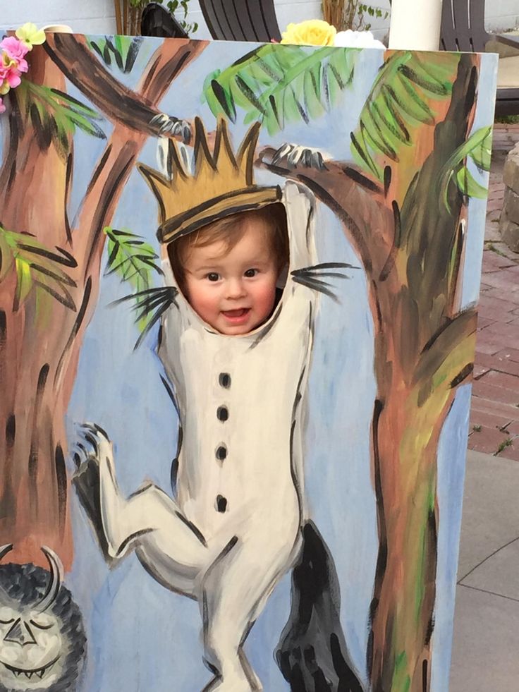 a painting of a child with a crown on his head standing in front of a tree