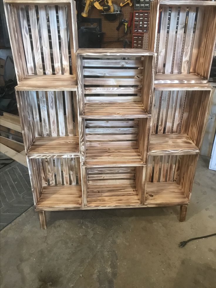 several wooden shelves stacked on top of each other