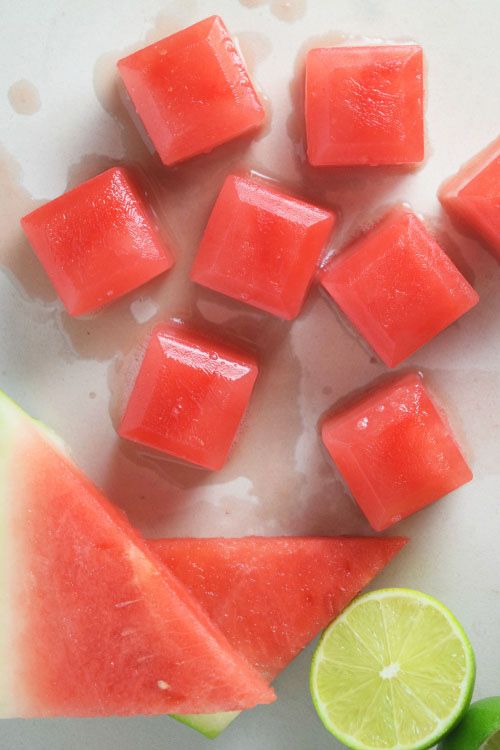 slices of watermelon and lime on a cutting board