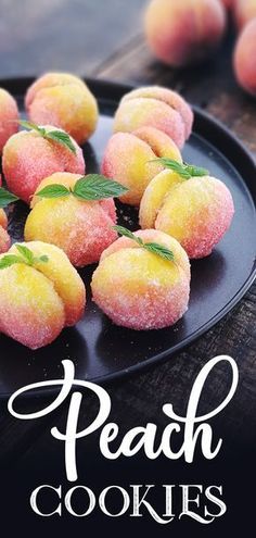 peach cookies on a black plate with mint sprigs and the words peach cookies