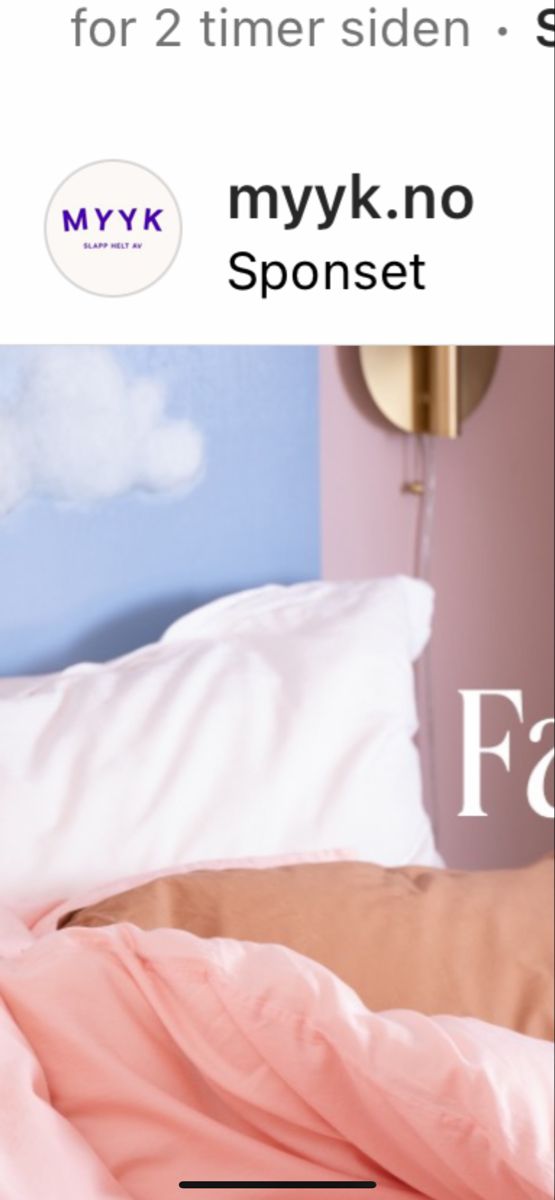 a bed with pink sheets and pillows in front of a blue wall that says, myk no spoonet