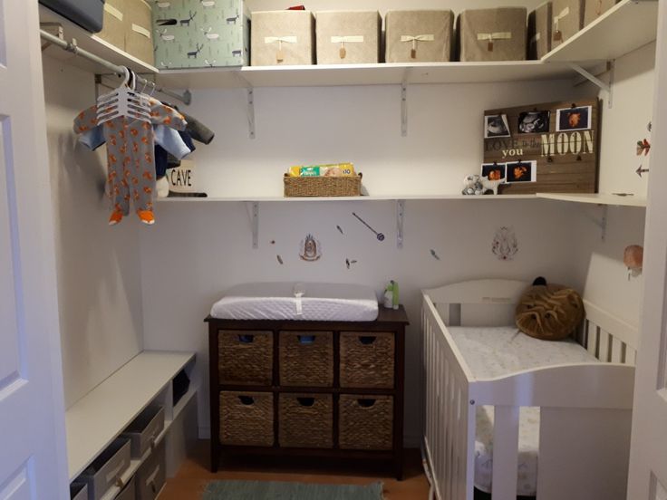 a baby's room with lots of storage space