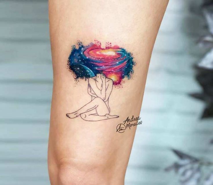 a woman's leg with a tattoo on it that has an image of a heart