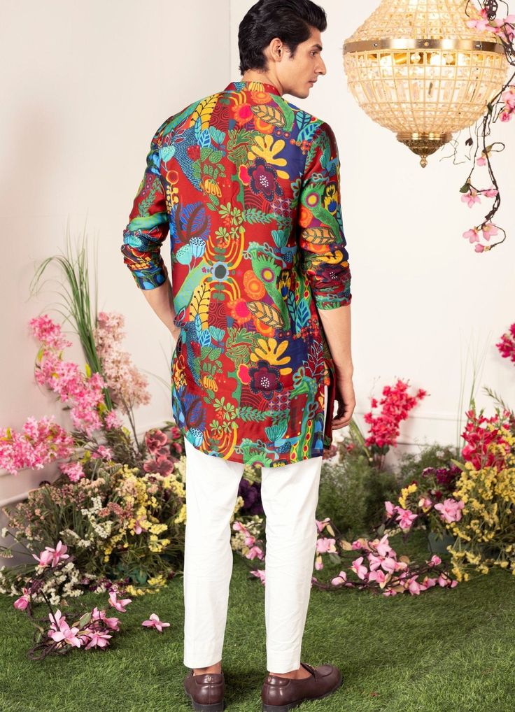 Introducing the Enchanted Forest Printed Kurta , an ideal ensemble for Mehendi and Sangeet. This printed kurta features a various vibrant botanical motifs on a crimson background, bringing an elegant vibe to your celebrations. Buy matching pants to complete the look here. Composition : Organza Satin Care: Dry Clean Only and Vacuum Storage This product can be customized for sleeves, length and colour Delivery : 2-4 weeks as the product is hand crafted. Check Size Guide or choose MySize for free customisation (All Sizes above XL can be made at 15% additional cost) For more information and sizes please contact fabiliciousfashion@gmail.com or visit our Copenhagen studio. About the Designer : Get ready to be blown away by the incredible talent of Juhi Bengani! This Kolkata-born actuary has disc Festive Floral Print Sets For Festivals, Multicolor Silk Kurta In Bollywood Style, Multicolor Silk Bollywood Kurta, Multicolor Floral Print Sets For Diwali, Festive Printed Silk Kurta, Printed Silk Kurta For Festive Occasions, Multicolor Designer Kurta For Summer, Bollywood Style Digital Print Kurta For Summer, Bollywood Style Kurta With Digital Print For Summer