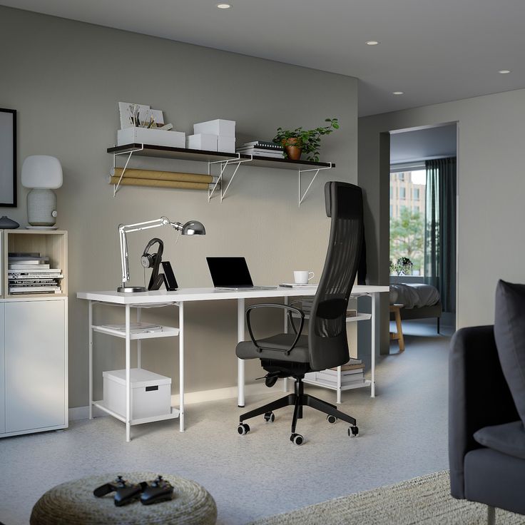 an office with a chair, computer desk and shelves on the wall in front of it