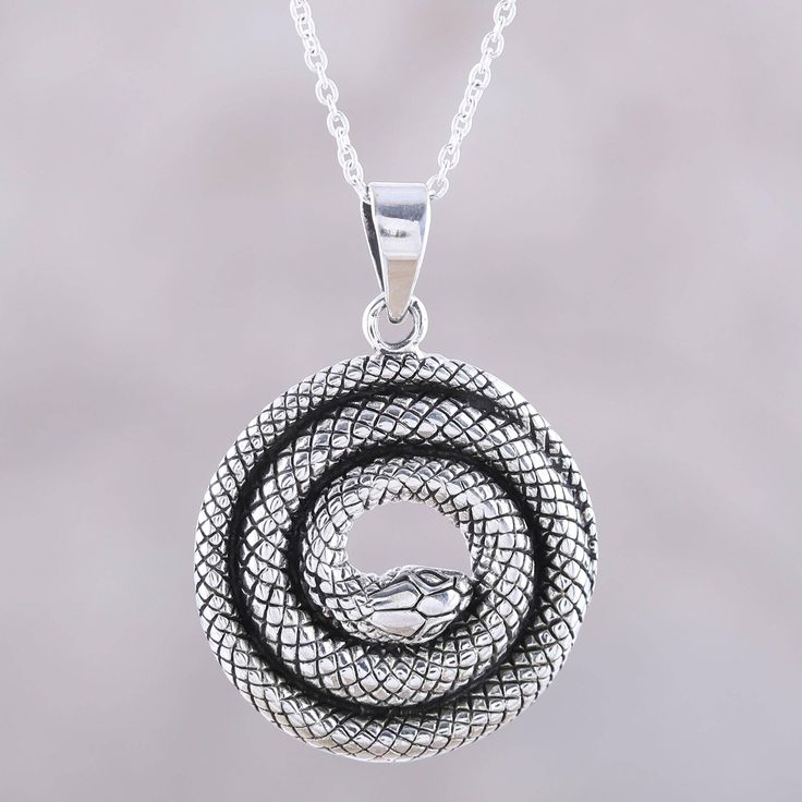 A coiled snake, with beautiful details such as textured scales, forms the pendant for this necklace designed by Neetu Barathi of India. The snake pendant hangs from a sterling silver cable chain that is adjustable in length. Coiled Snake, Snake Pendant, Citrine Earrings, Labradorite Earrings, The Snake, Sterling Silver Dangle Earrings, Sterling Silver Necklace Pendants, Silver Earrings Dangle, Jewelry Packaging