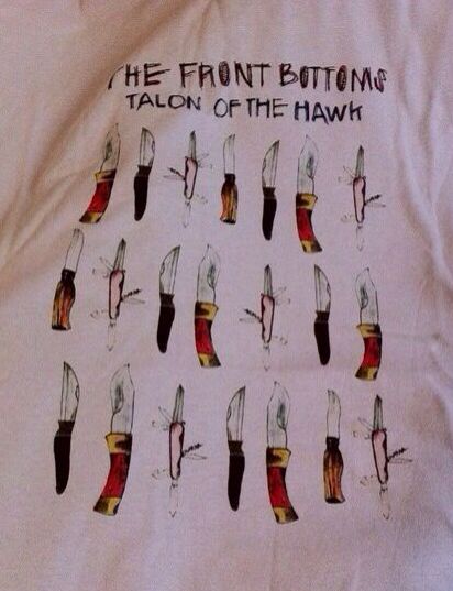 the front bottoms of a white t - shirt with scissors drawn on it and words that read, the front bottoms talon of the hawk