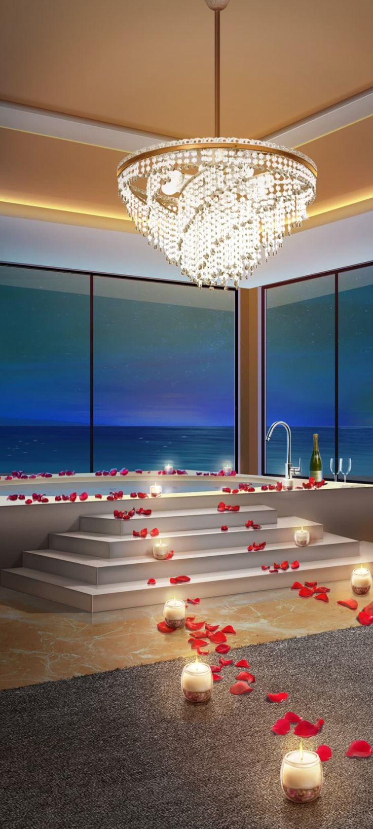 a large room with candles and flowers on the floor next to windows overlooking the ocean