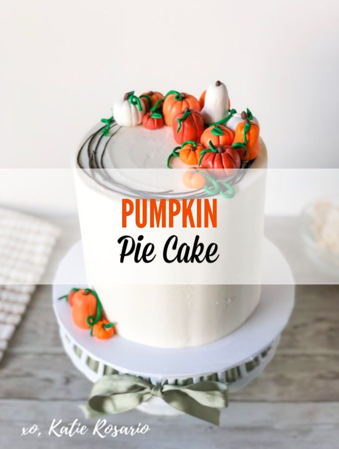 a pumpkin pie cake sitting on top of a white plate with the words pumpkin pie in front of it