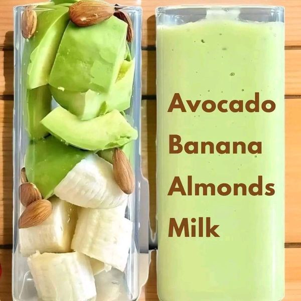 a container filled with sliced bananas and almonds next to a bottle of green liquid