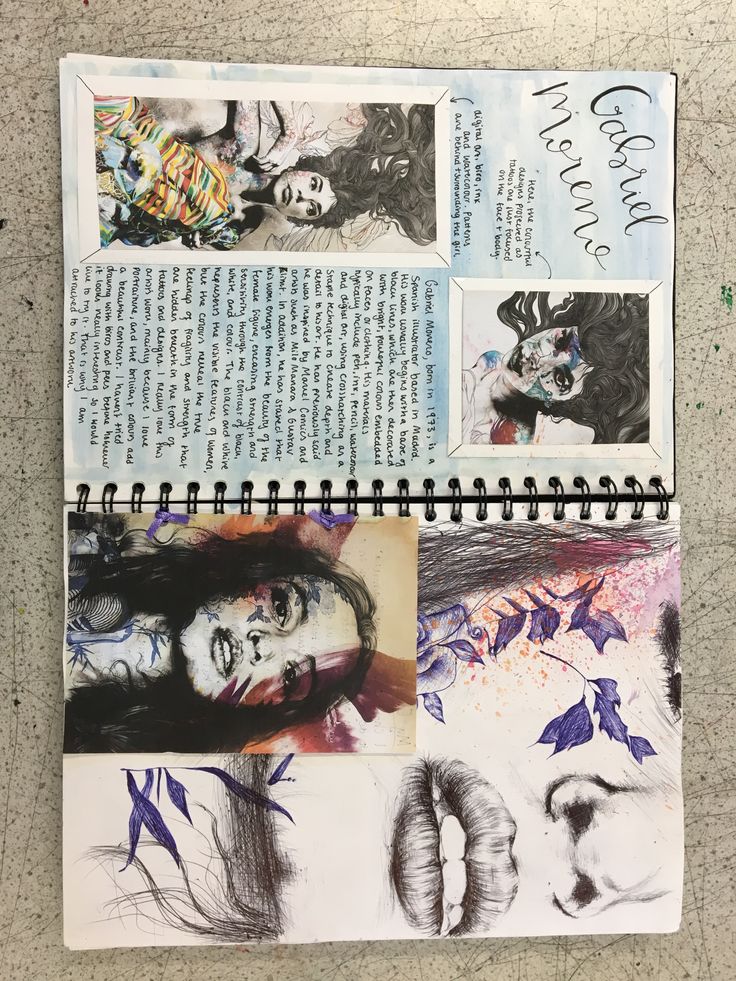 an open notebook with drawings on it and some words written in the bottom right corner