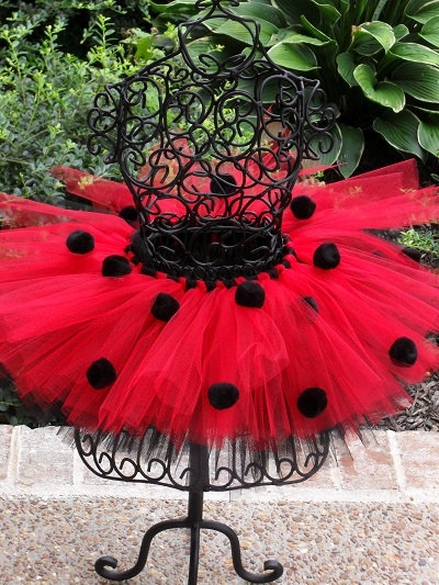 a red tutu skirt with black polka dots on it