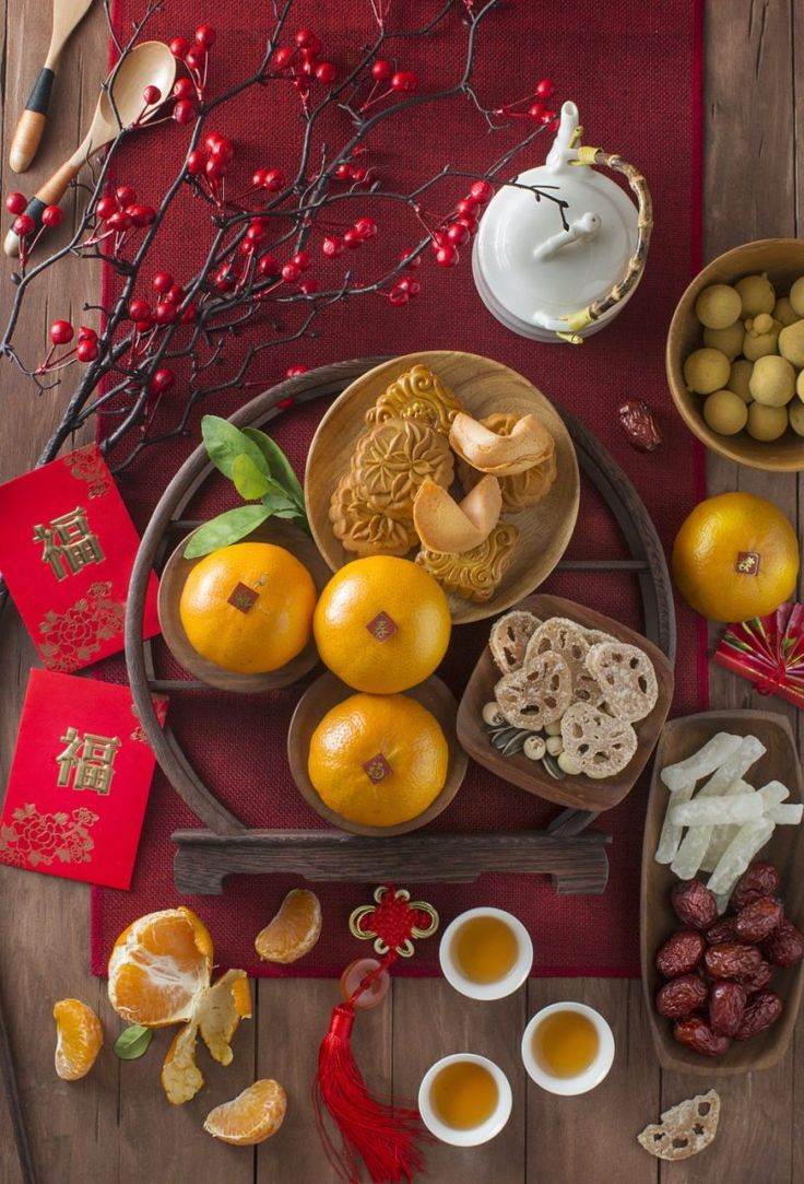 an assortment of chinese food on a wooden table stock photo