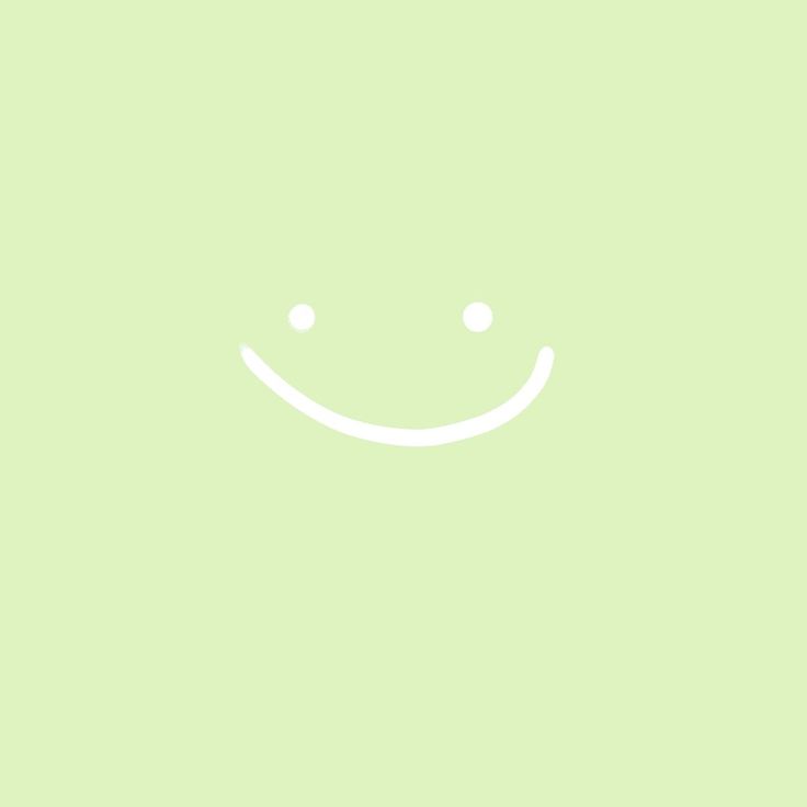 a green background with a smiley face drawn on it